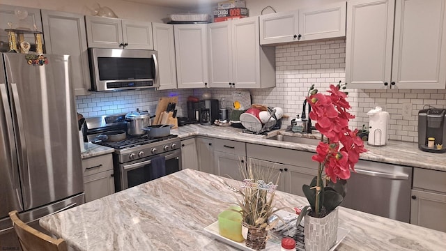 1620 N Michigan Ave, Atlantic City, NJ 08401 - kitchen featuring stainless steel appliances, light stone counters, and decorative backsplash