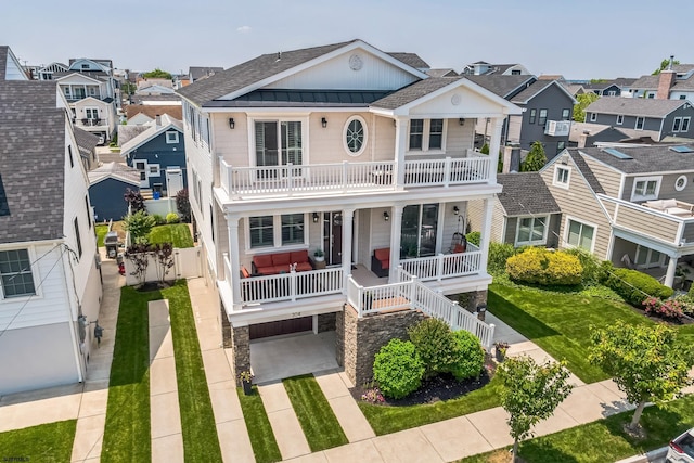 304 N Thurlow Ave, Margate, NJ 08402 - raised beach house featuring covered porch, a balcony, a residential view, roof with shingles, and a standing seam roof