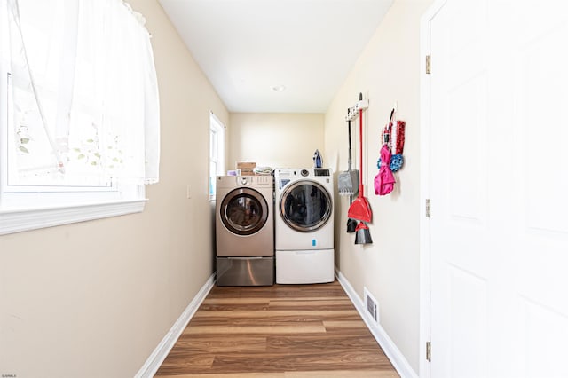 628 1st Ave, Galloway Township, NJ 08205 - laundry room featuring washer and clothes dryer and light wood-type flooring