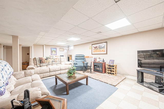 628 1st Ave, Galloway Township, NJ 08205 - living room featuring a paneled ceiling and tile patterned floors