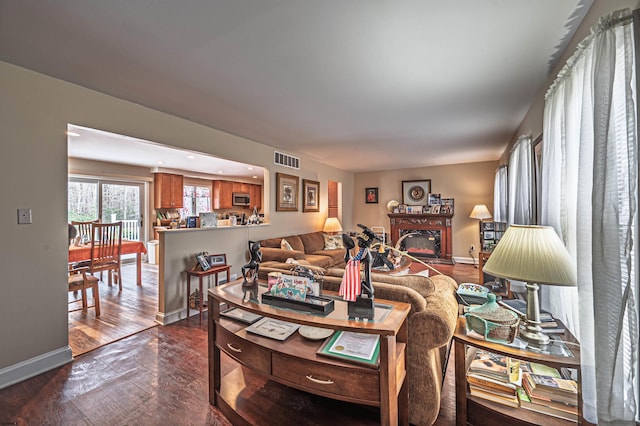 628 1st Ave, Galloway Township, NJ 08205 - living area with dark wood finished floors and a glass covered fireplace