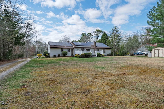 628 1st Ave, Galloway Township, NJ 08205 - ranch-style home with a shed, roof mounted solar panels, a front yard, and driveway