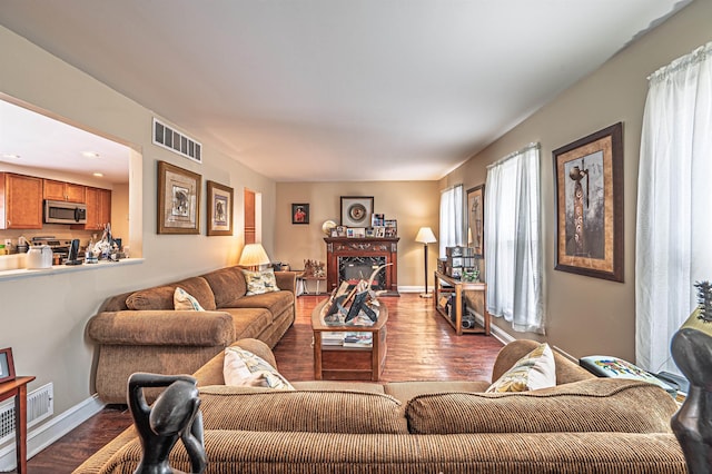 628 1st Ave, Galloway Township, NJ 08205 - living area with dark wood-style floors and a glass covered fireplace