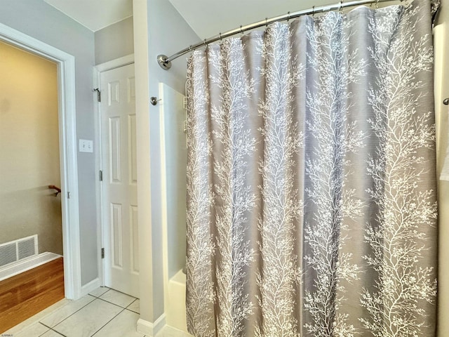 331 Asbury Ave Unit 2, Ocean City, NJ 08226 - full bath featuring tile patterned floors and shower / bath combo with shower curtain