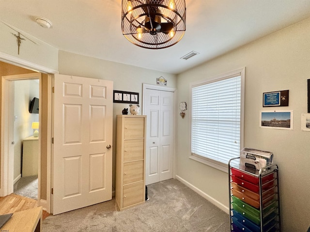 331 Asbury Ave Unit 2, Ocean City, NJ 08226 - bedroom with light carpet, a chandelier, and a closet