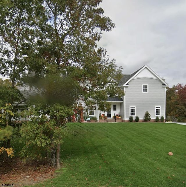 5 Thicket St, Ocean View, NJ 08230 - rear view of property with a yard