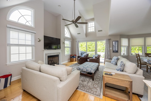 1611 Central Ave Unit 2, Ocean City, NJ 08226 - living room featuring a ceiling fan, light wood-style flooring, a fireplace, and high vaulted ceiling