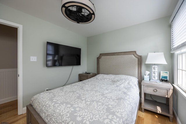 1611 Central Ave Unit 2, Ocean City, NJ 08226 - bedroom with light wood-type flooring and a wainscoted wall