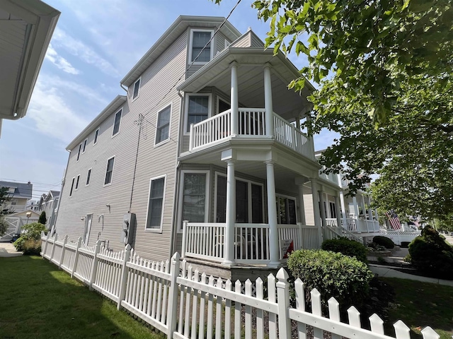 1611 Central Ave Unit 2, Ocean City, NJ 08226 - view of property exterior with a porch, a balcony, and a fenced front yard