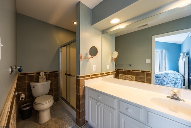 1611 Central Ave Unit 2, Ocean City, NJ 08226 - bathroom with tile walls, tile patterned flooring, vanity, a stall shower, and wainscoting