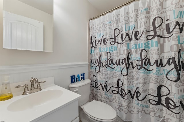7929 Dune Dr Unit 310, Avalon Boro, NJ 08202 - bathroom with vanity, curtained shower, and a wainscoted wall