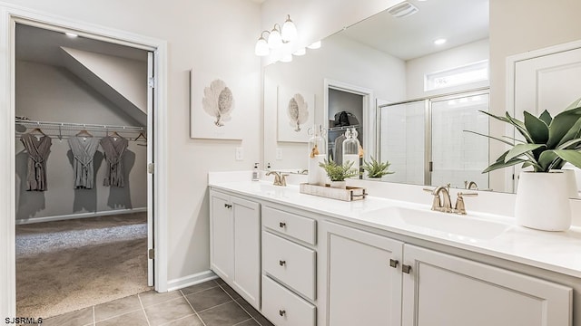 57 Siegtown Rd, Middle Township, NJ 08210 - bathroom featuring double vanity, a shower stall, a walk in closet, and tile patterned floors