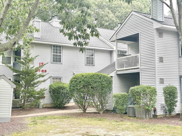 57 Waterview Dr Unit 57, Galloway Township, NJ 08205 - view of side of property featuring a balcony, a chimney, and a shingled roof
