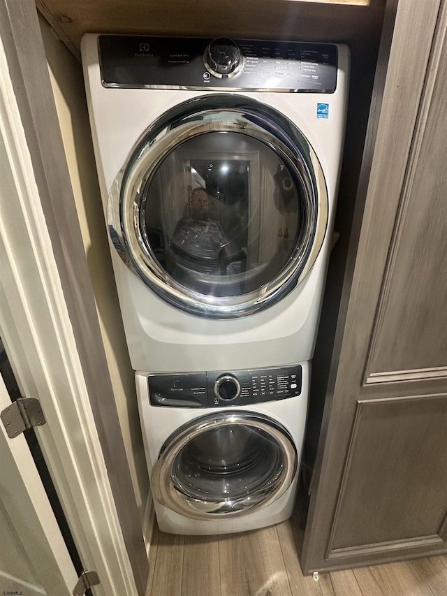 57 Waterview Dr Unit 57, Galloway Township, NJ 08205 - laundry room with estacked washer and dryer and wood finished floors