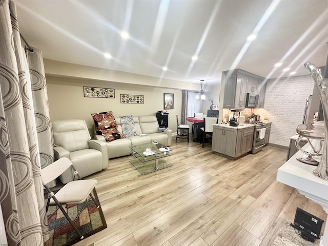 57 Waterview Dr Unit 57, Galloway Township, NJ 08205 - living room with light wood-style floors and brick wall