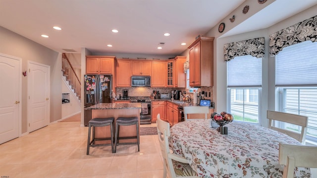 229 Lander Rd, Egg Harbor Township, NJ 08234 - kitchen featuring black appliances, recessed lighting, a kitchen island, decorative backsplash, and glass insert cabinets