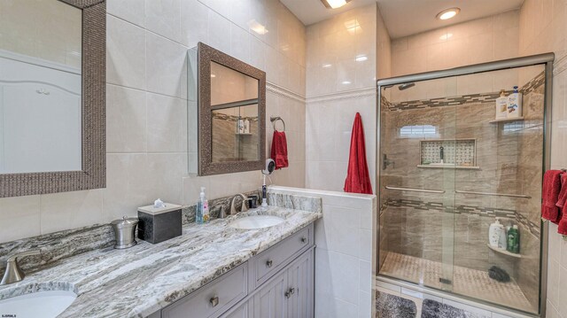 229 Lander Rd, Egg Harbor Township, NJ 08234 - full bathroom featuring double vanity, a shower stall, and tile walls