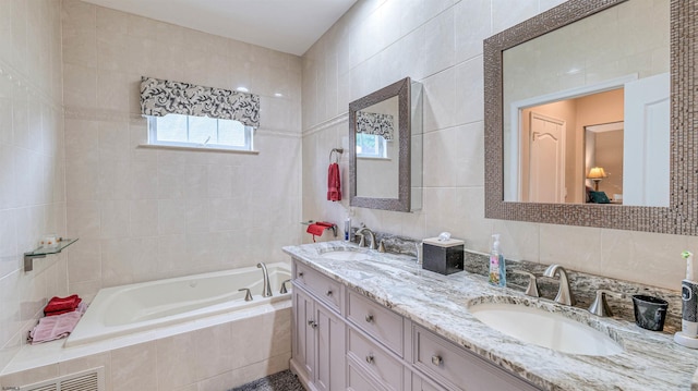 229 Lander Rd, Egg Harbor Township, NJ 08234 - bathroom with tile walls, a garden tub, and double vanity