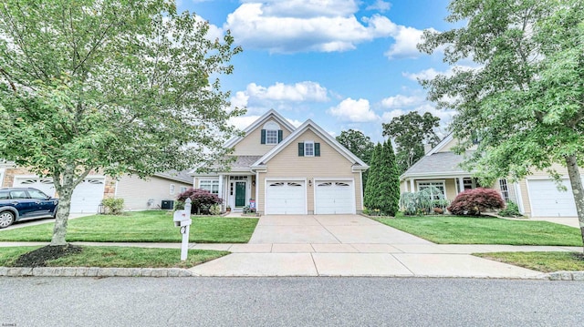229 Lander Rd, Egg Harbor Township, NJ 08234 - traditional-style house featuring concrete driveway, a garage, and a front yard