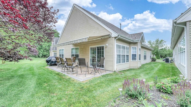 229 Lander Rd, Egg Harbor Township, NJ 08234 - back of house featuring a patio, a yard, and a shingled roof