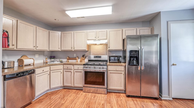 332 N Massachusetts Ave, Atlantic City, NJ 08401 - kitchen featuring appliances with stainless steel finishes, under cabinet range hood, and light wood-style floors