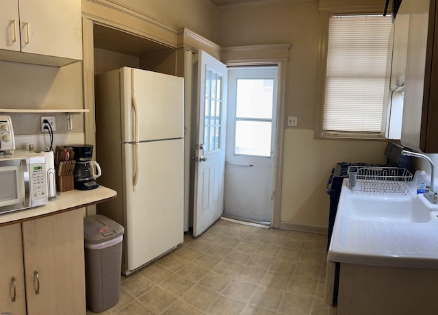 215 N Dorset, Ventnor Heights, NJ 08406 - kitchen featuring freestanding refrigerator, stainless steel microwave, light countertops, and light floors