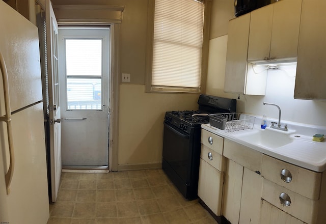 215 N Dorset, Ventnor Heights, NJ 08406 - kitchen featuring black gas stove, freestanding refrigerator, and light countertops