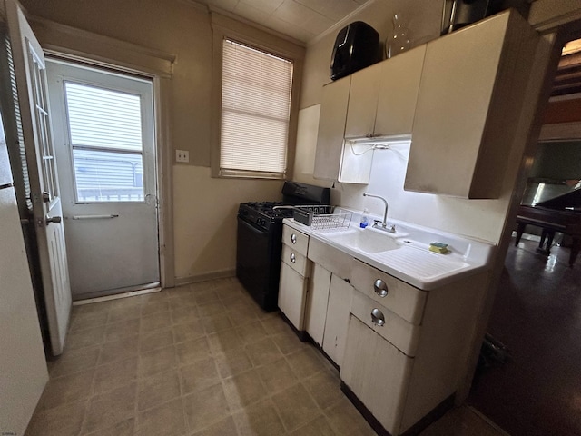 215 N Dorset, Ventnor Heights, NJ 08406 - kitchen featuring black gas stove, light countertops, and white cabinetry