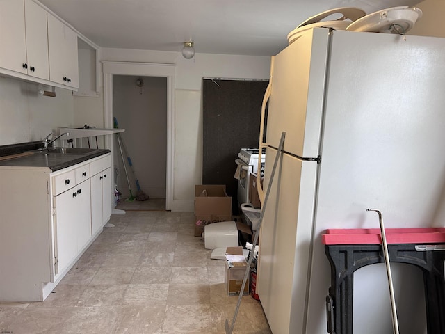 215 N Dorset, Ventnor Heights, NJ 08406 - kitchen featuring freestanding refrigerator, white cabinetry, and dark countertops