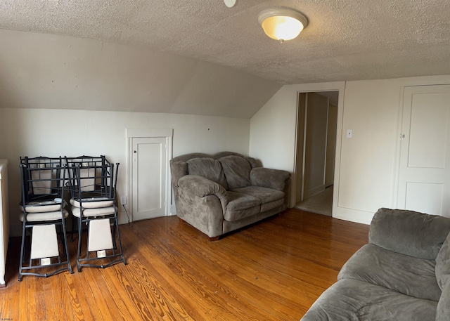 215 N Dorset, Ventnor Heights, NJ 08406 - living room featuring wood finished floors, a textured ceiling, and lofted ceiling