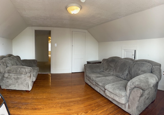 215 N Dorset, Ventnor Heights, NJ 08406 - living room featuring wood finished floors, vaulted ceiling, and a textured ceiling