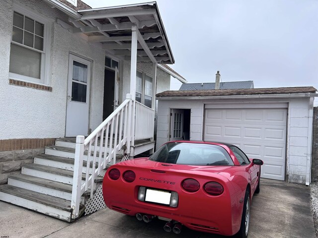 215 N Dorset, Ventnor Heights, NJ 08406 - property entrance with a garage and roof with shingles
