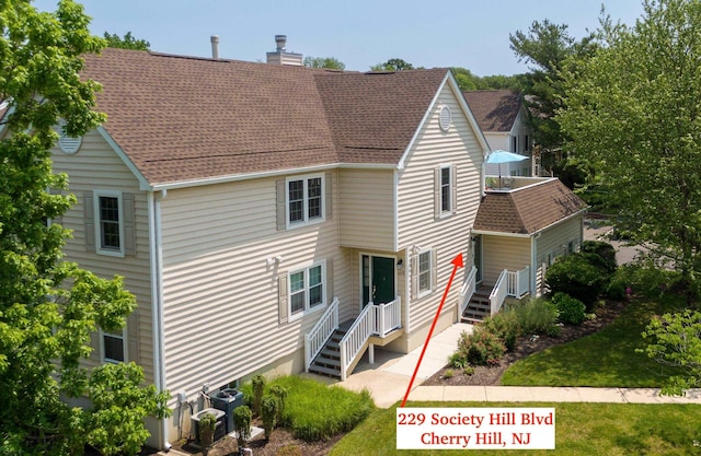 229 Society Hill Blvd Unit 229, Cherry Hill, NJ 08003 - back of house featuring a chimney, a yard, and a shingled roof