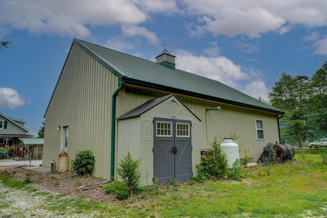 1081 Rte 50, Petersburg, NJ 08270 - view of property exterior featuring a chimney, a shed, and a metal roof