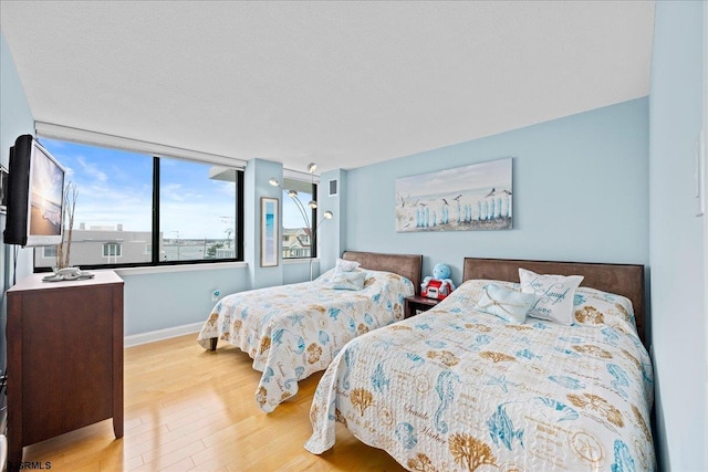 111 S 16th Ave Unit 415, Longport, NJ 08403 - bedroom featuring wood finished floors and baseboards