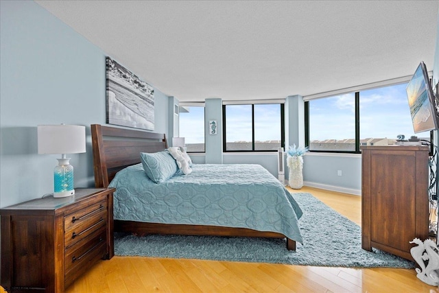 111 S 16th Ave Unit 415, Longport, NJ 08403 - bedroom with light wood-style floors and baseboards