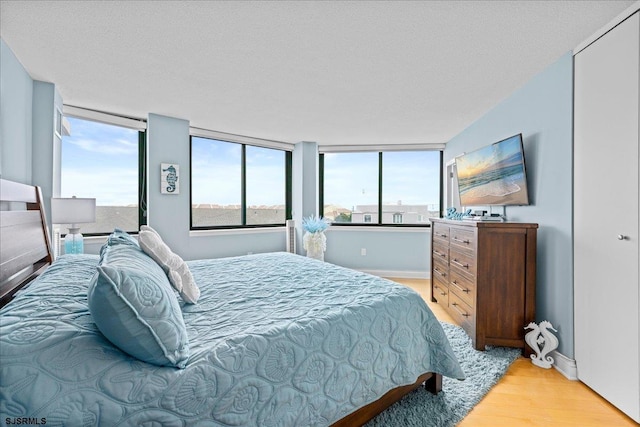 111 S 16th Ave Unit 415, Longport, NJ 08403 - bedroom with light wood-style floors and baseboards
