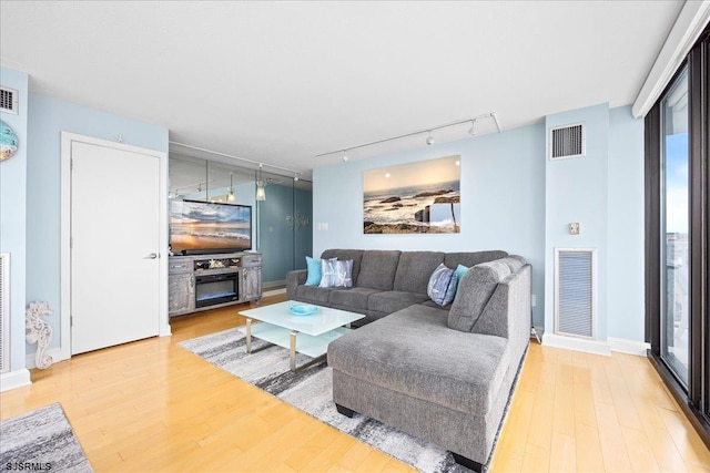 111 S 16th Ave Unit 415, Longport, NJ 08403 - living area with rail lighting and light wood-style floors