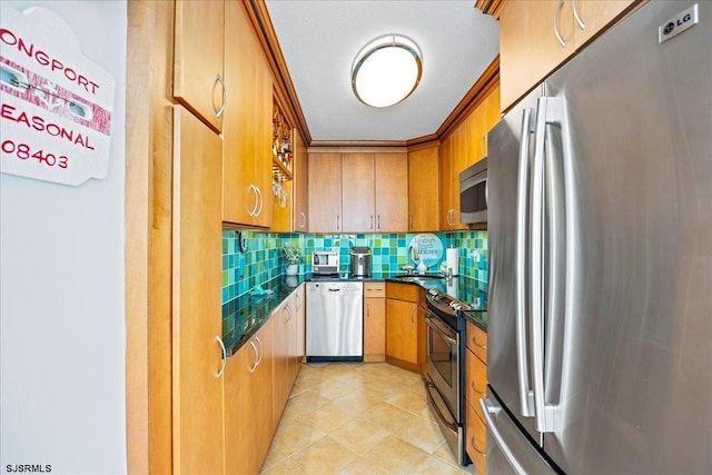 111 S 16th Ave Unit 415, Longport, NJ 08403 - kitchen featuring stainless steel appliances, dark countertops, tasteful backsplash, brown cabinets, and light tile patterned floors