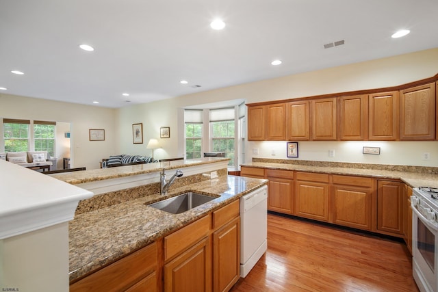 11 Brampton St, Galloway Township, NJ 08205 - kitchen featuring white appliances, healthy amount of natural light, light stone countertops, recessed lighting, and light wood-style flooring