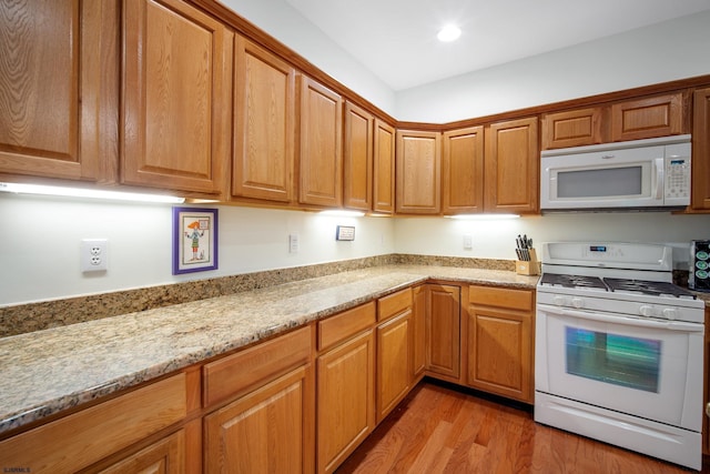 11 Brampton St, Galloway Township, NJ 08205 - kitchen with white appliances, light wood-type flooring, light stone counters, recessed lighting, and brown cabinets