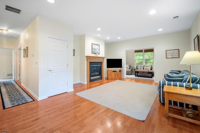 11 Brampton St, Galloway Township, NJ 08205 - living room with light wood finished floors, a glass covered fireplace, and recessed lighting