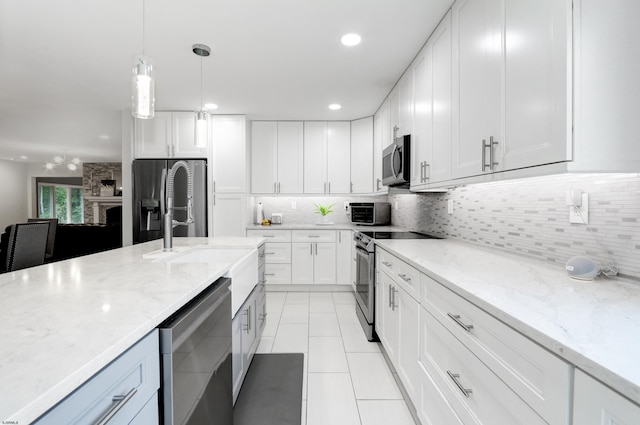 106 Hillside Ave, Absecon, NJ 08201 - kitchen with appliances with stainless steel finishes, white cabinets, tasteful backsplash, light tile patterned flooring, and recessed lighting