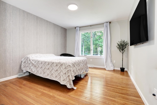 106 Hillside Ave, Absecon, NJ 08201 - bedroom with wallpapered walls and light wood-type flooring
