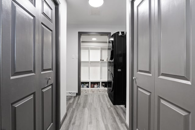 106 Hillside Ave, Absecon, NJ 08201 - corridor with stacked washer / drying machine and light wood finished floors