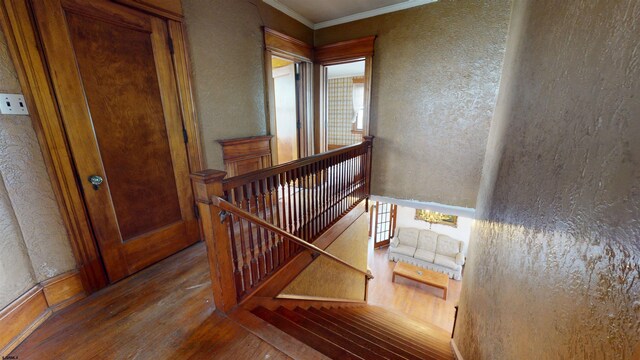 717 Wabash Ave, Atlantic City, NJ 08401 - stairway with wood finished floors, crown molding, and a textured wall