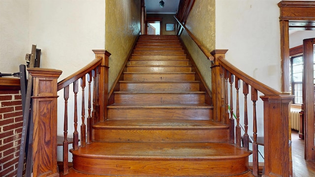 717 Wabash Ave, Atlantic City, NJ 08401 - stairs with wood finished floors, a towering ceiling, and crown molding