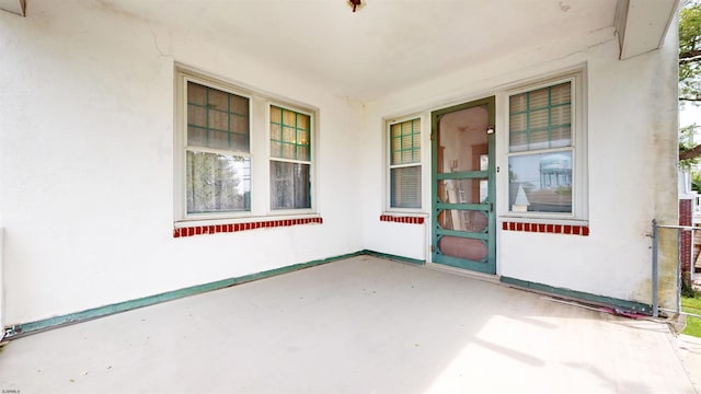 717 Wabash Ave, Atlantic City, NJ 08401 - view of exterior entry with stucco siding and covered porch