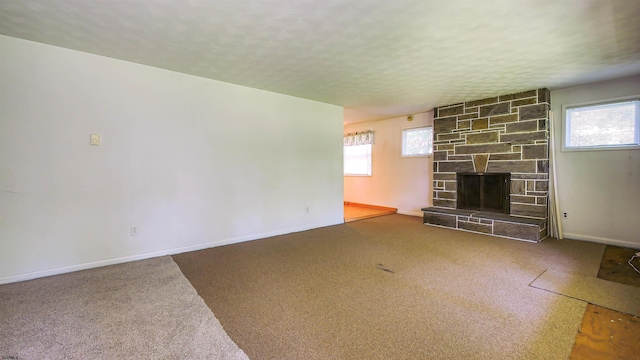 116 Post Rd, Mays Landing, NJ 08330 - unfurnished living room featuring carpet floors and a stone fireplace