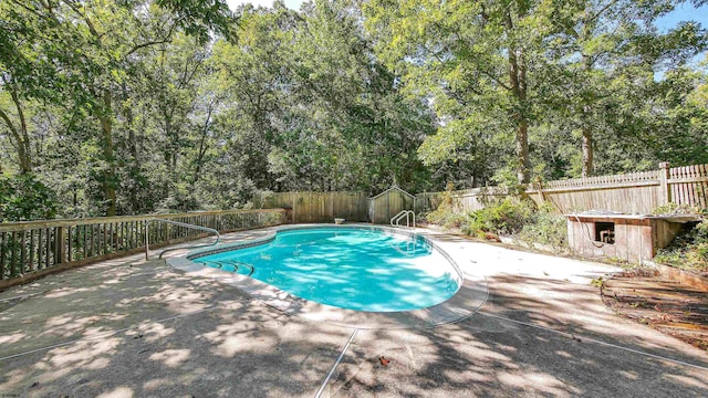 116 Post Rd, Mays Landing, NJ 08330 - view of pool featuring a fenced backyard, a patio, a storage unit, and view of wooded area